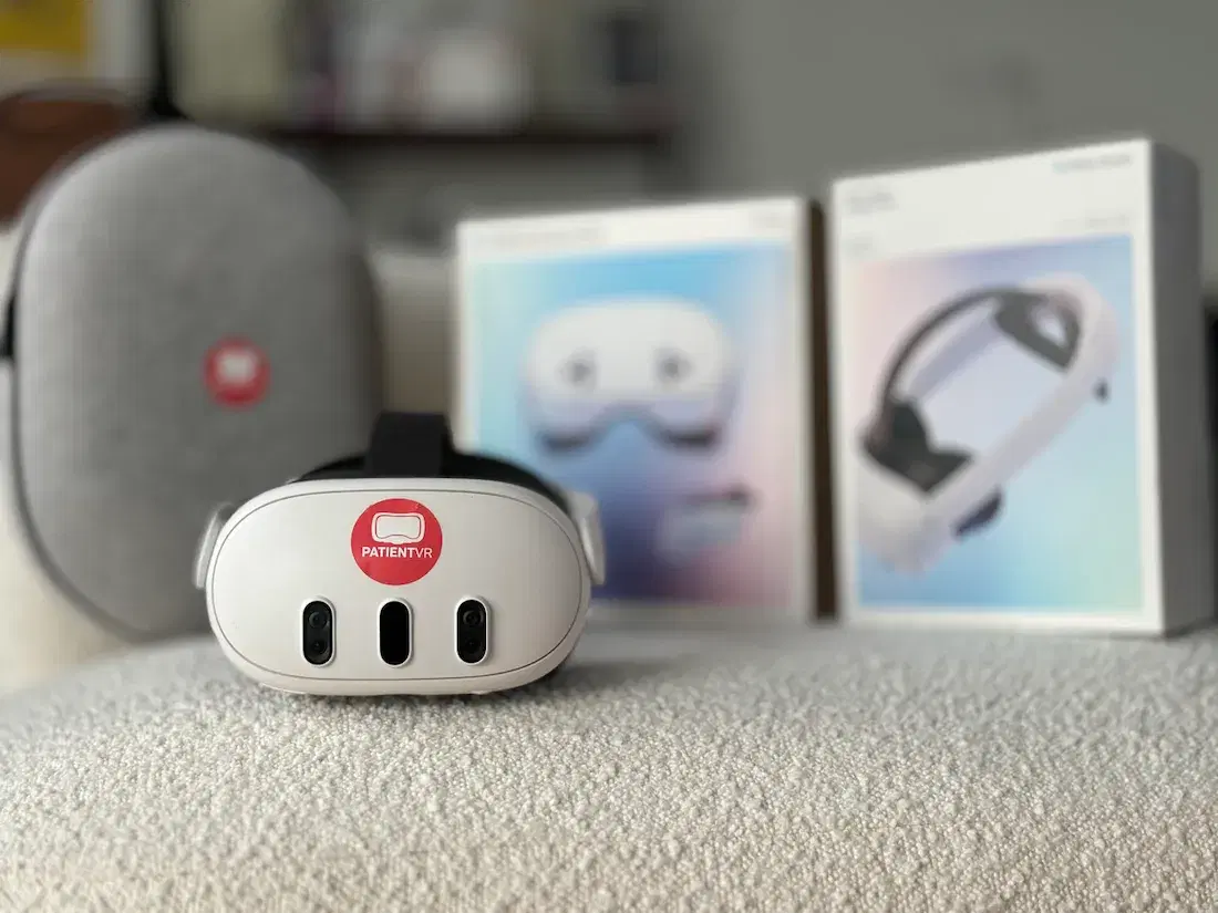 A PatientVR-branded VR headset in front of its boxes